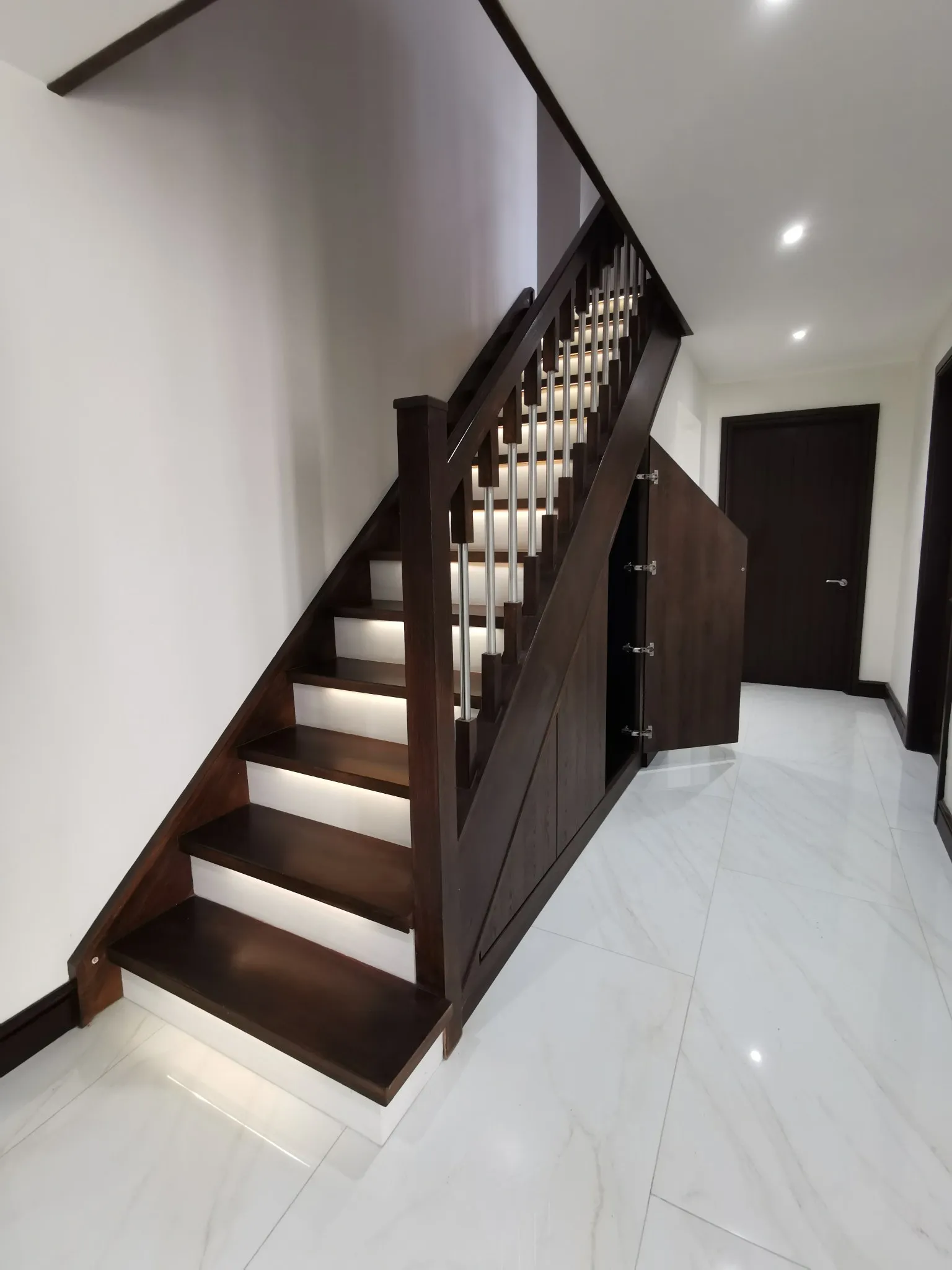 The third, larger walnut unit open on soft close hinges