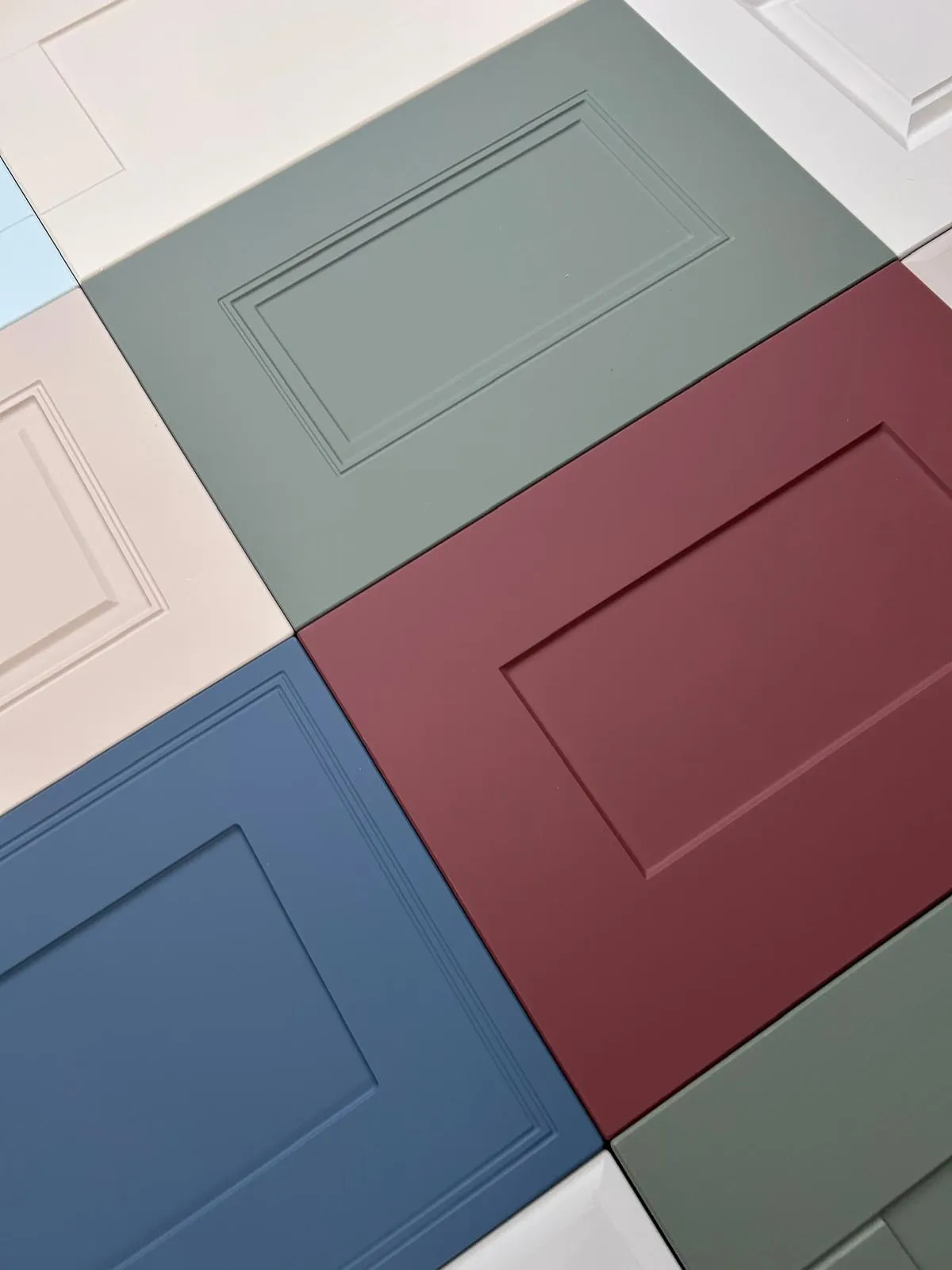 Real StairFit door samples in matt green, burgundy, blue and neutral finishes